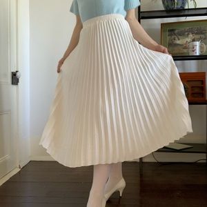 cream pleated midi length skirt
